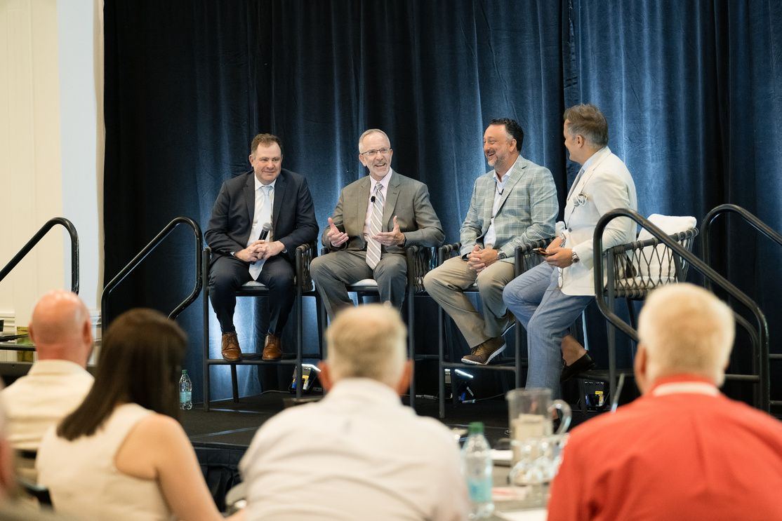 Panelists on stage at Clarity
