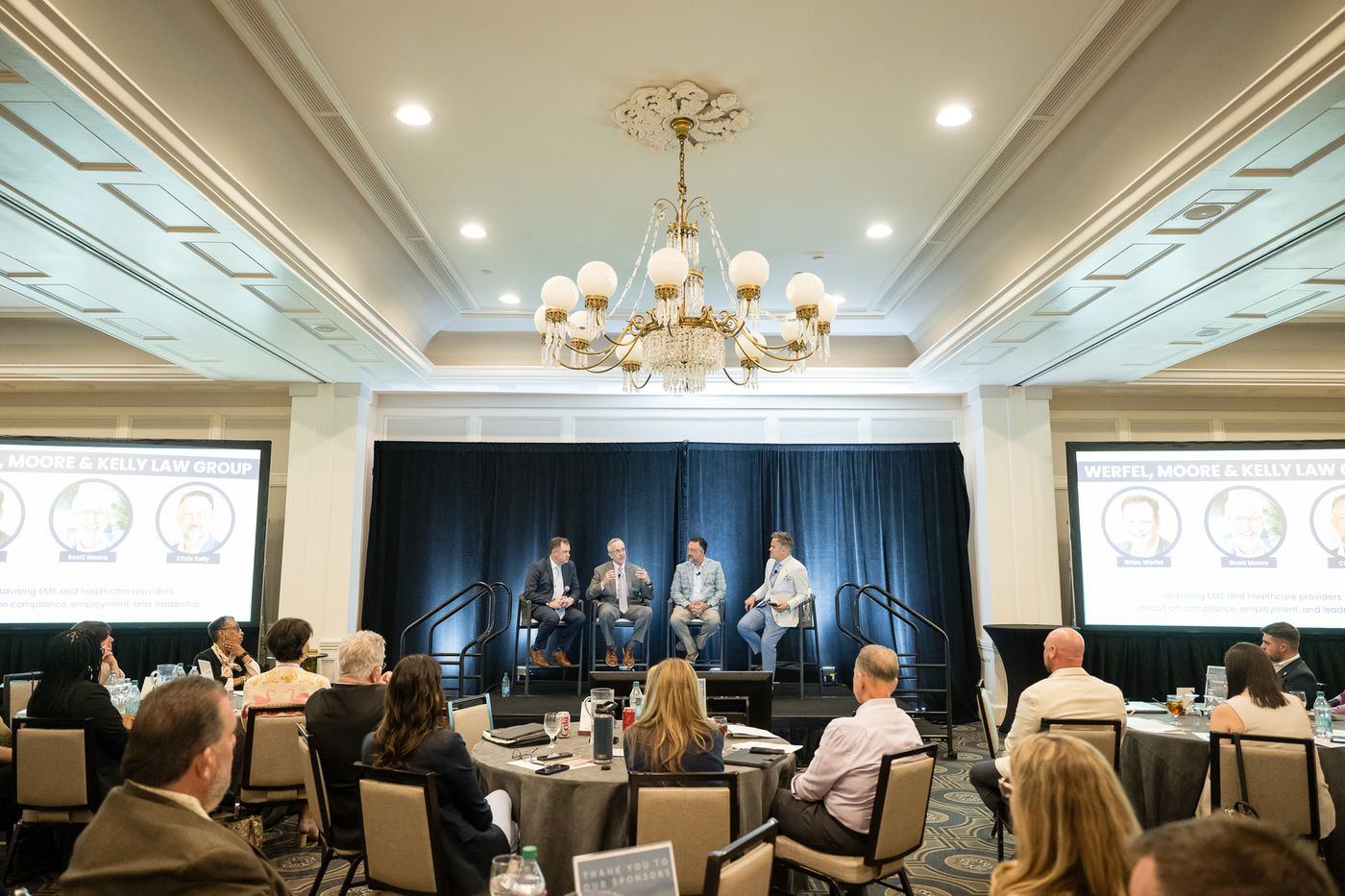 A wide view of a panel session in the general session room