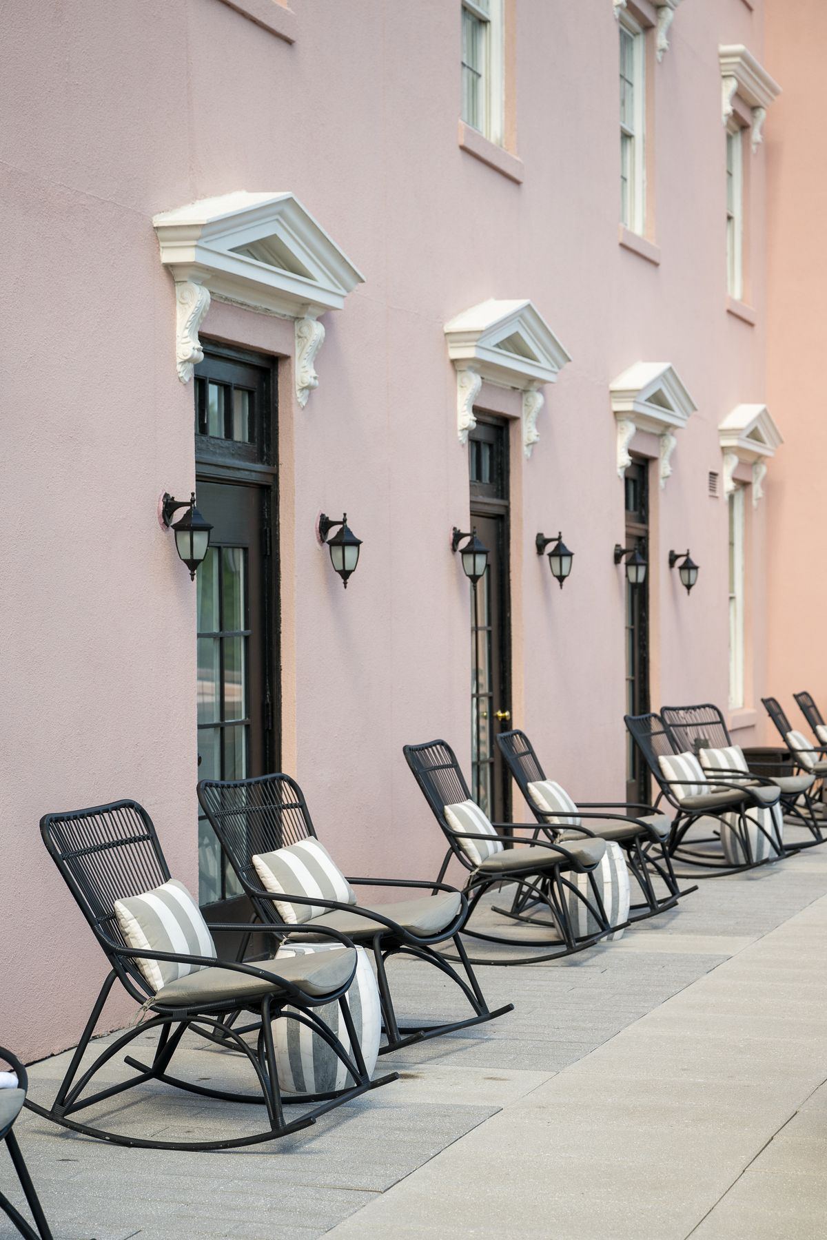 Rocking chairs along a Charleston facade